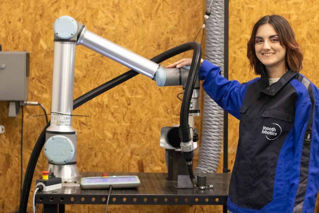Optimize Your Cobot Welding System: 4 Must-Know Insights for a Profitable Investment 2 a woman welder standing next to cobot welding system