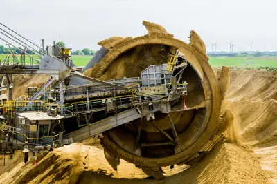 a large machine in a dirt field