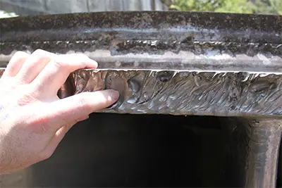 Hydroelectric turbine blade showing heavy water erosion