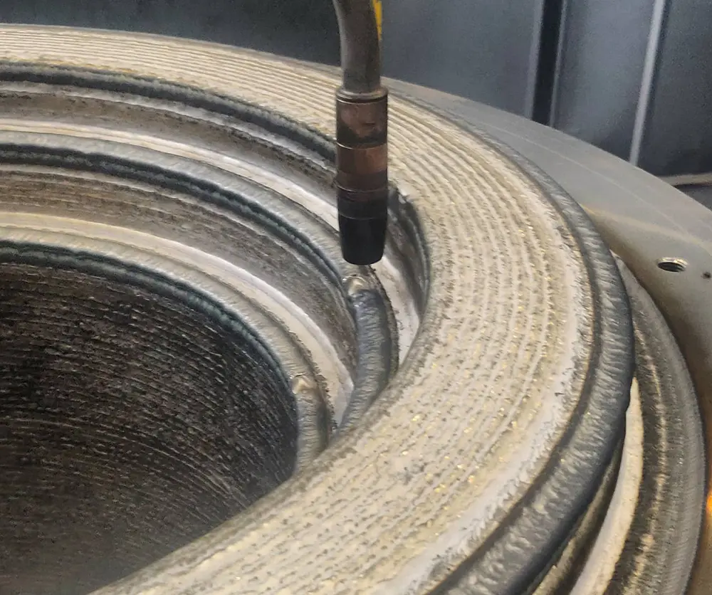 Cladding Explained: Understanding Its Role and Applications 6 Example of cladding with robotic MIG welding