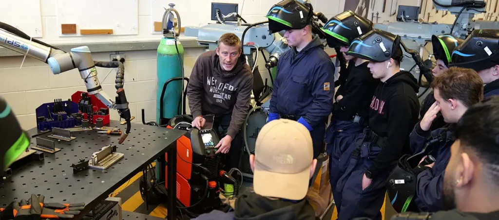Transforming Welding Education at New College Lanarkshire with Cobot Welding 3 Steven from Kemppi UK showing settings on the power source to students