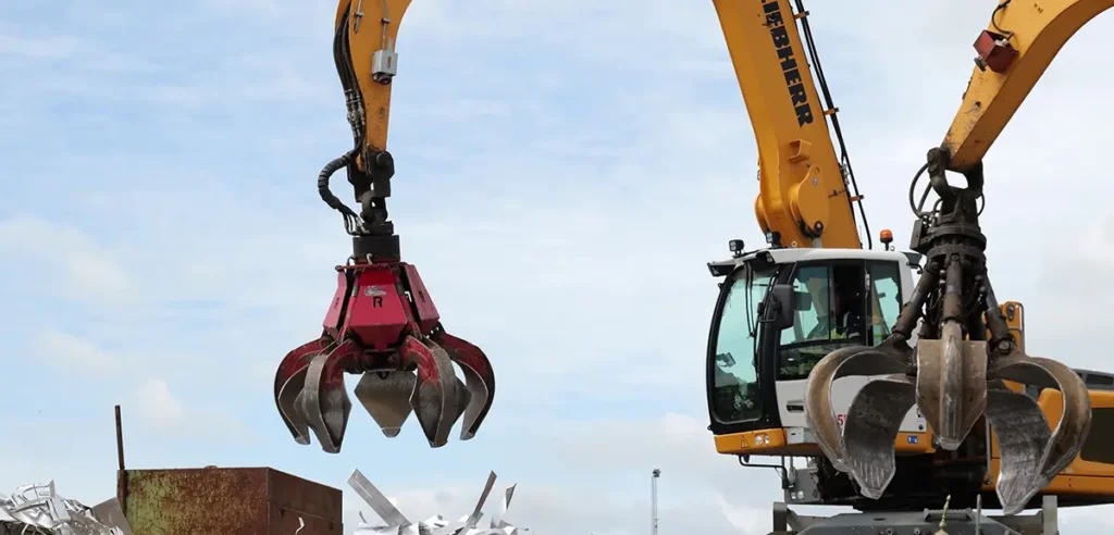 a crane with a red grab