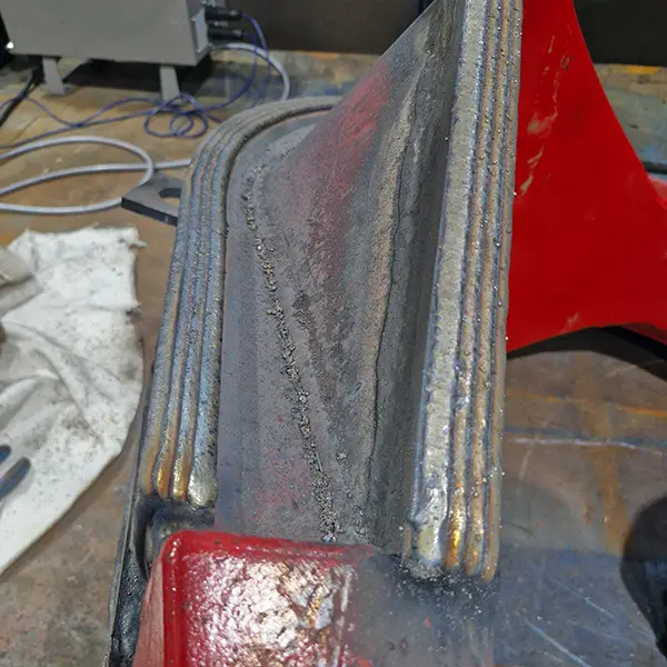 Hardfacing welds on a grab